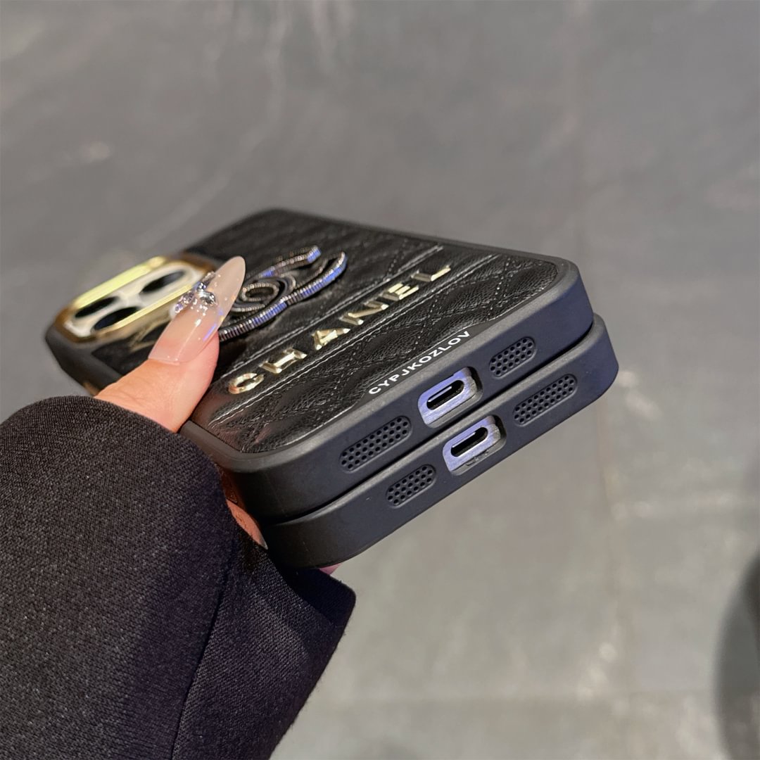 Chanel-inspired quilted iPhone case with sparkling emblem