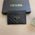Prada-inspired chevron card wallet with triangle detail, black
