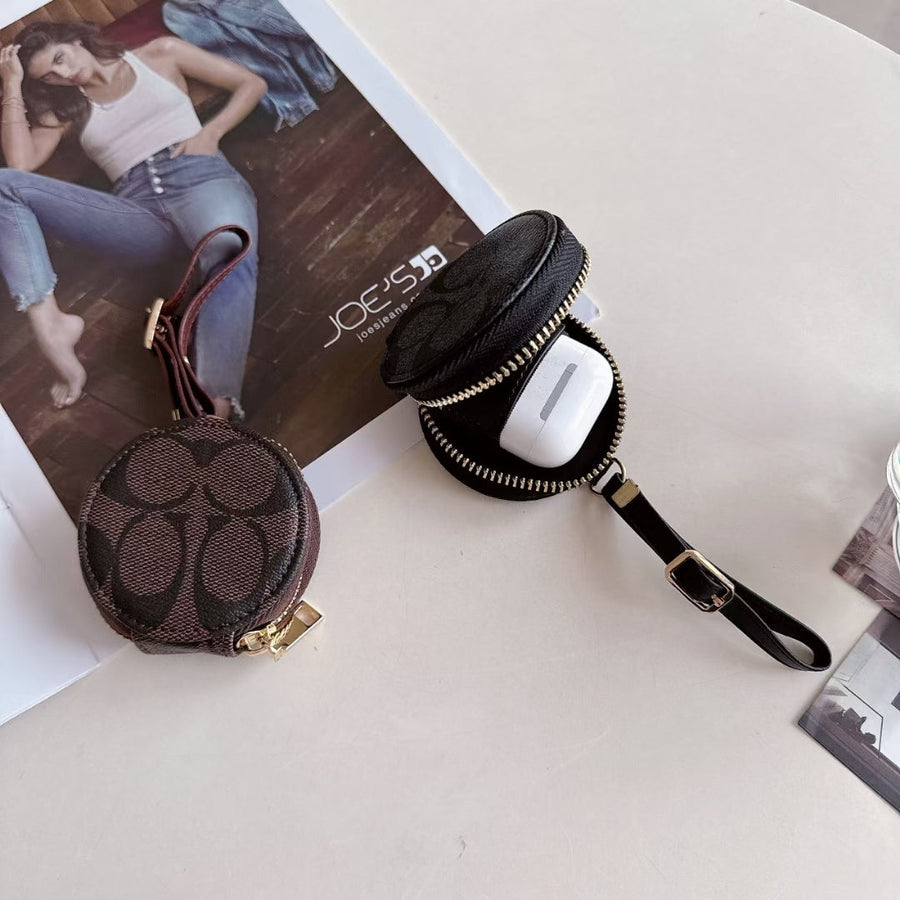 Coach-inspired round monogram AirPods case with wrist strap