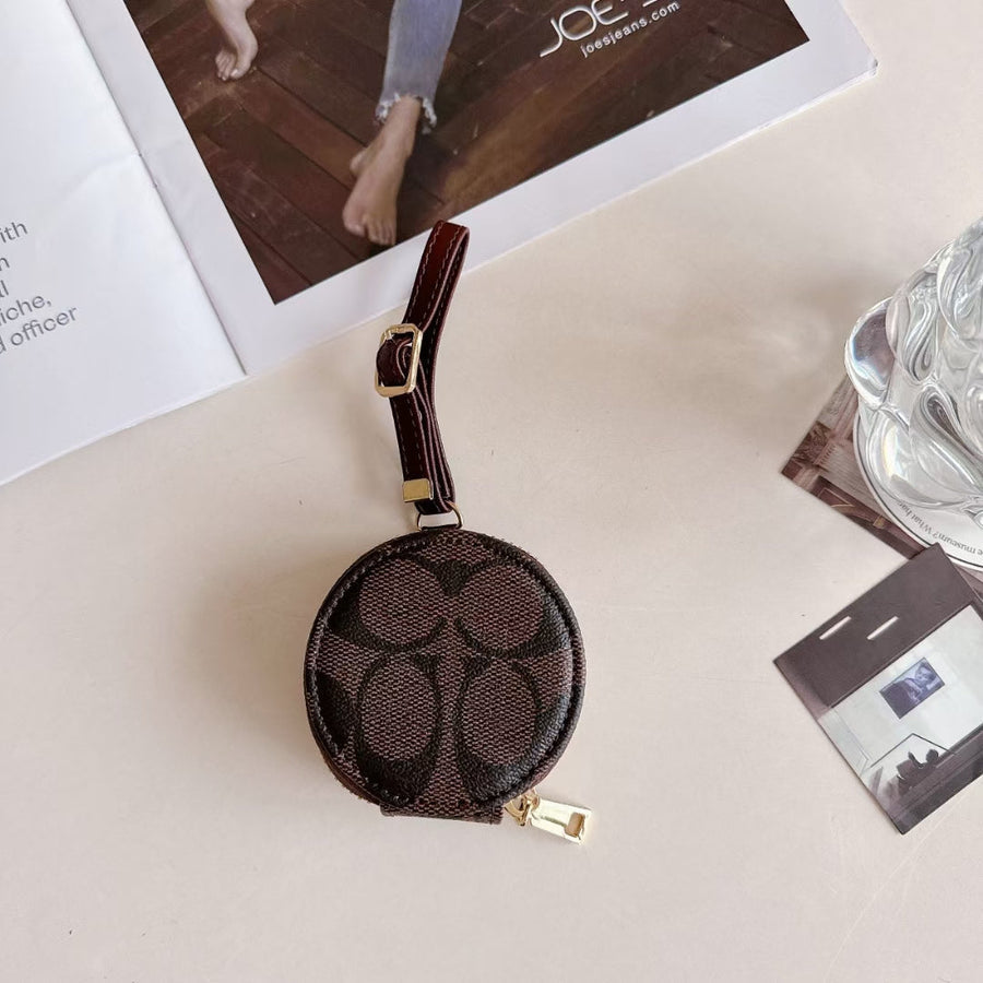 Coach-inspired round monogram AirPods case with wrist strap