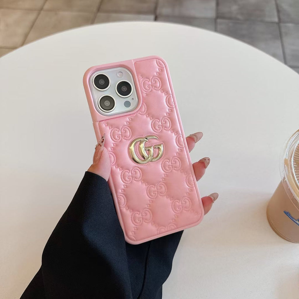 Gucci-inspired quilted iPhone case with metal emblem
