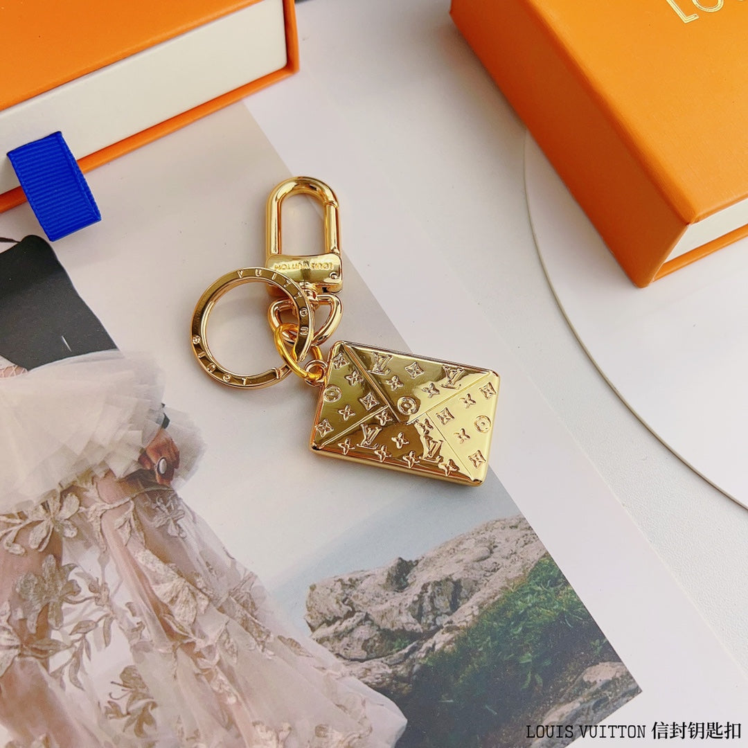 Louis Vuitton-inspired gold-tone envelope charm keychain