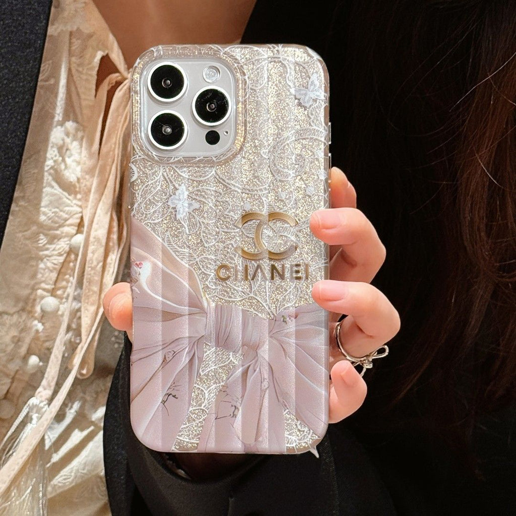 Chanel-inspired pearl finish iPhone case with bow and strap