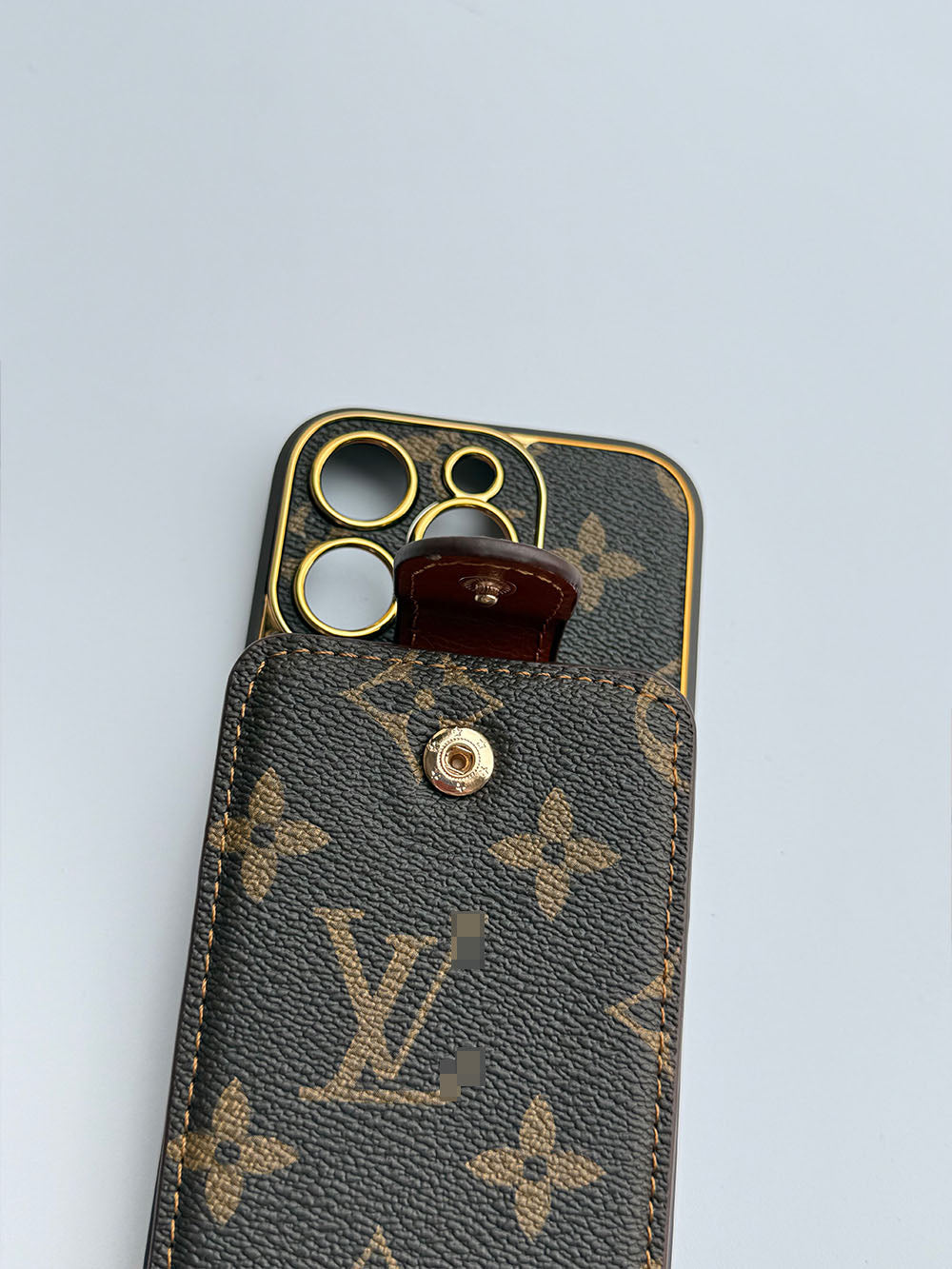 Louis Vuitton-inspired brown iPhone case with wallet card and strap