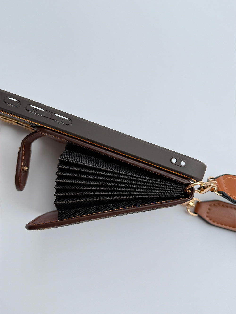 Louis Vuitton-inspired brown iPhone case with wallet card and strap