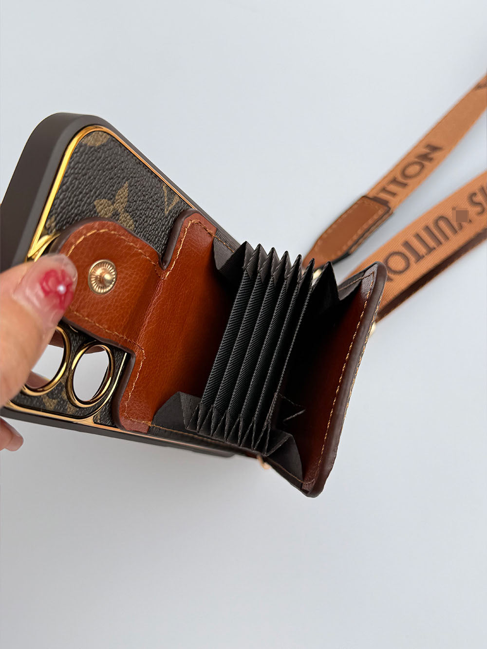 Louis Vuitton-inspired brown iPhone case with wallet card and strap