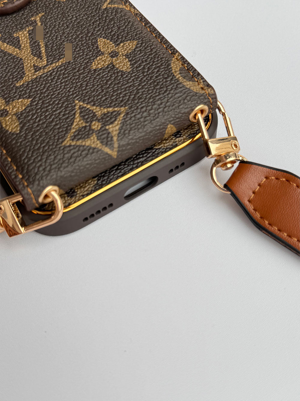 Louis Vuitton-inspired brown iPhone case with wallet card and strap