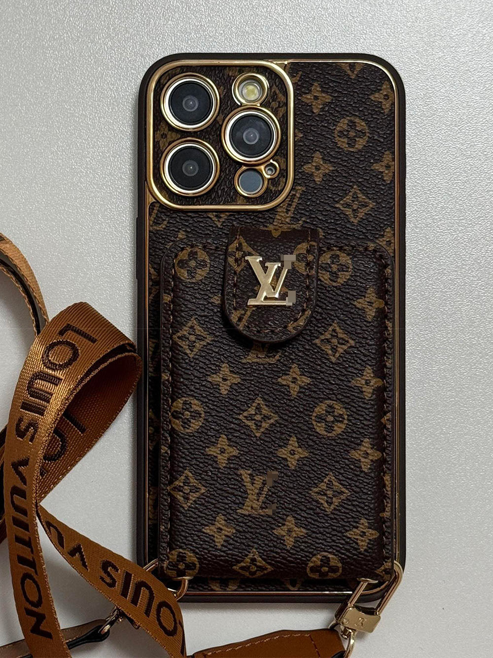 Louis Vuitton-inspired brown iPhone case with wallet card and strap