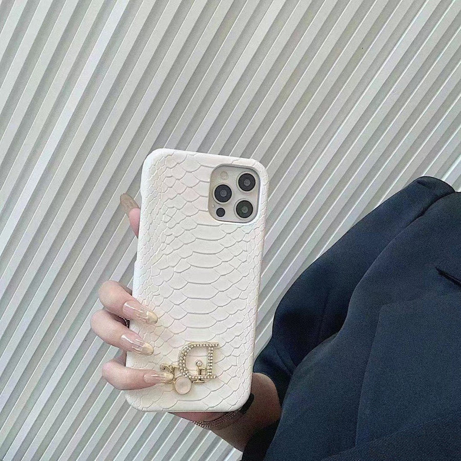Dior-inspired snake texture iPhone case with emblem detail