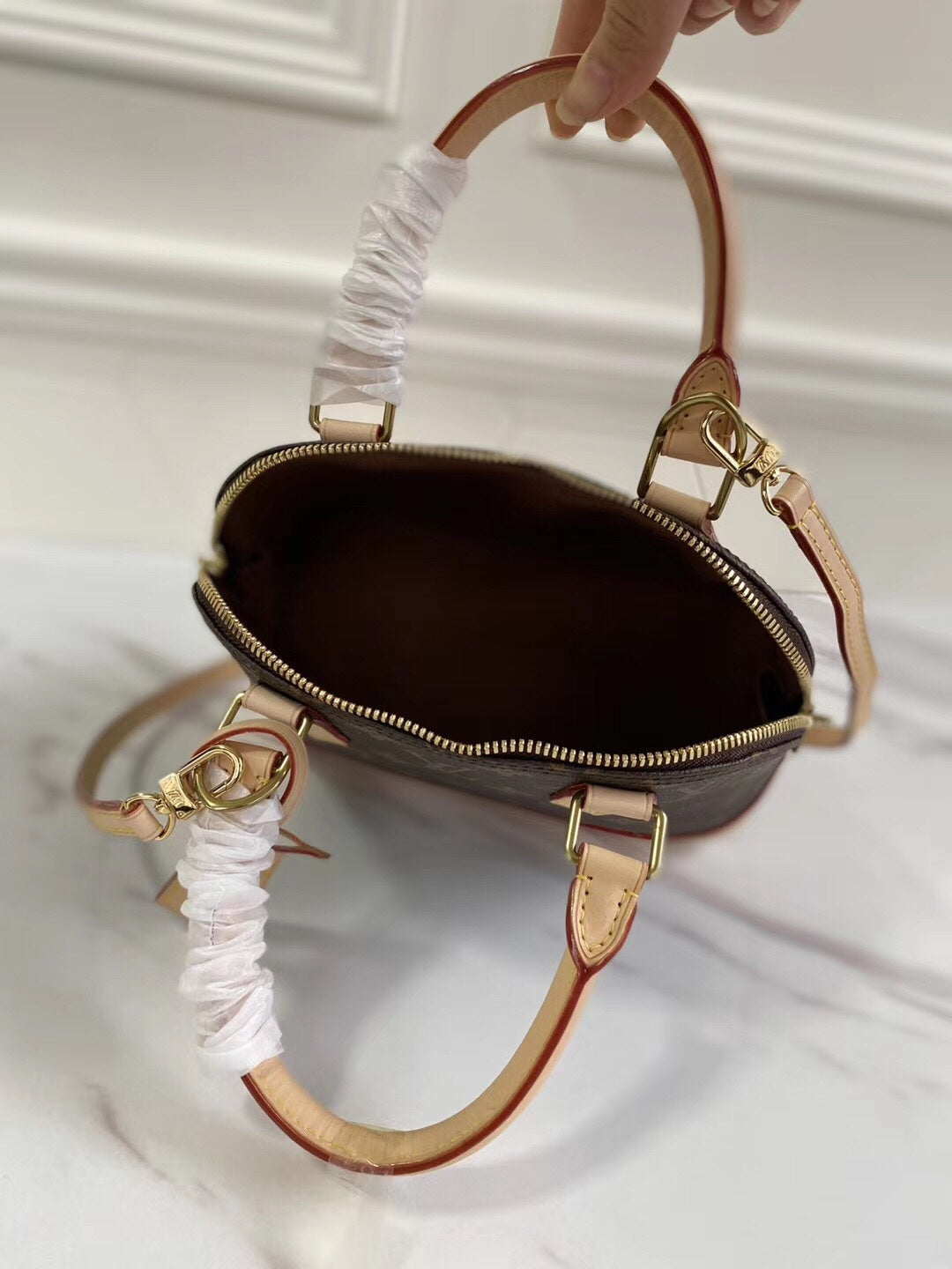 Louis Vuitton-inspired dome-shaped monogram handbag