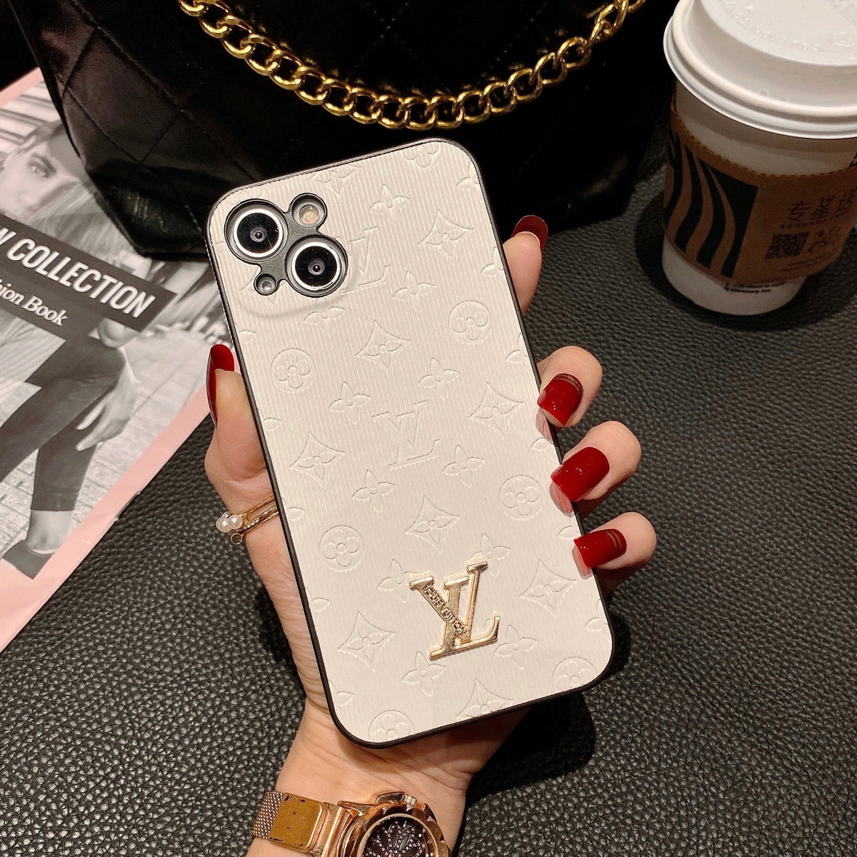 Louis Vuitton-inspired textured iPhone case with gold-tone emblem
