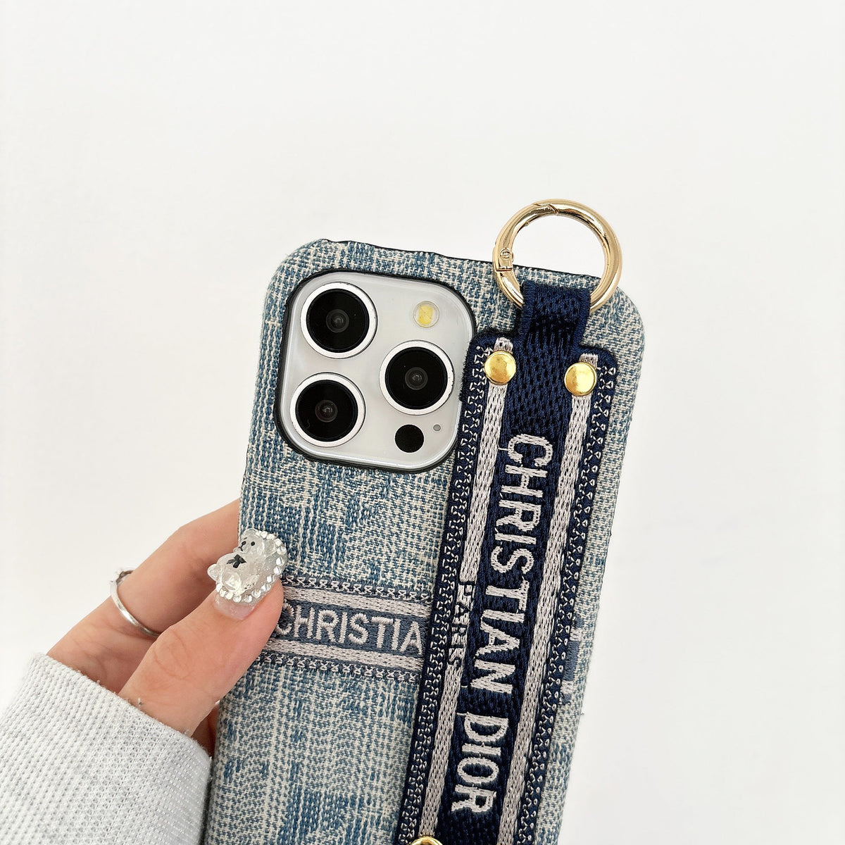 Dior-inspired patterned phone case with wide hand strap