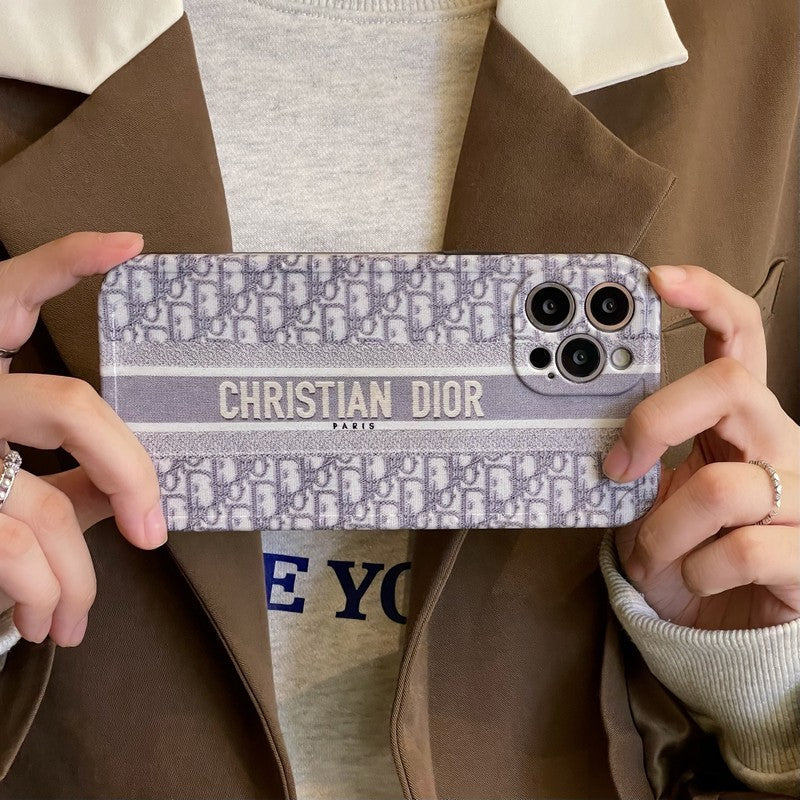 Dior-inspired patterned iPhone case with chain accent