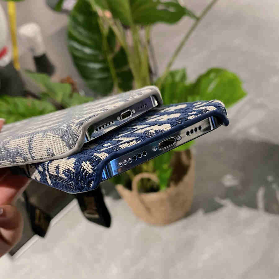 Dior-inspired all-over pattern phone case with hand strap