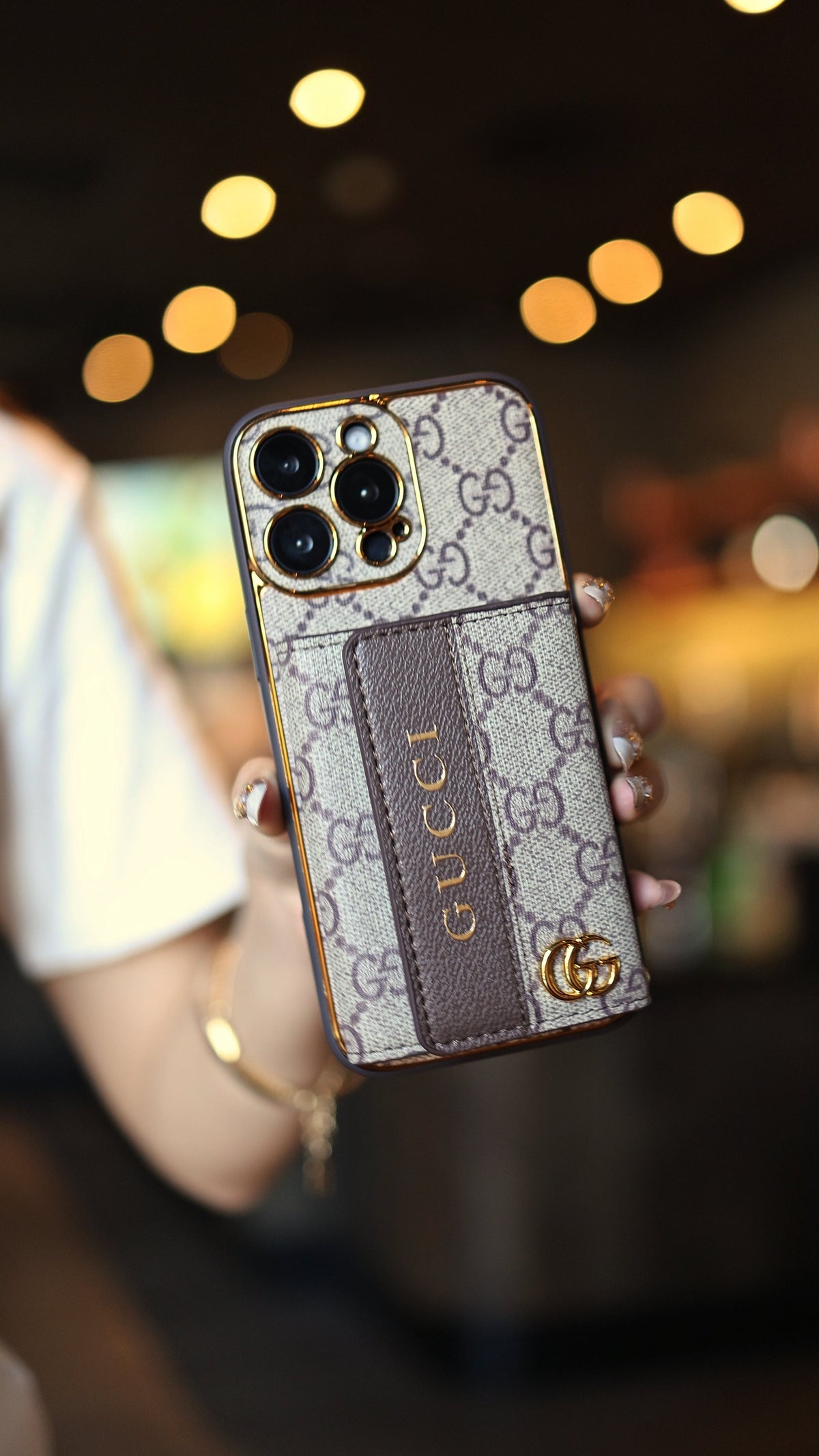 Louis Vuitton-inspired leather iPhone case with card holder and strap