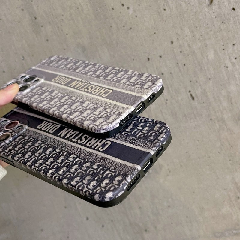 Dior-inspired patterned iPhone case with chain accent