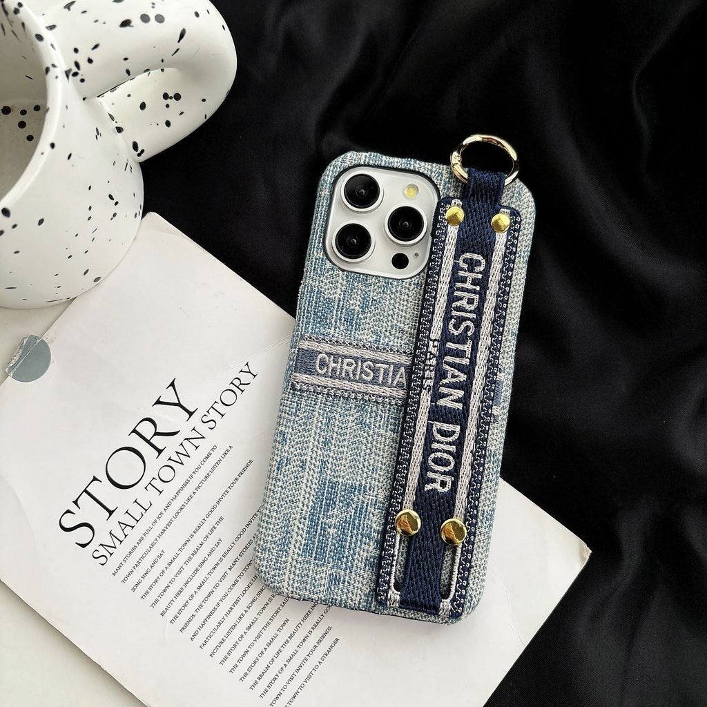 Dior-inspired patterned phone case with wide hand strap