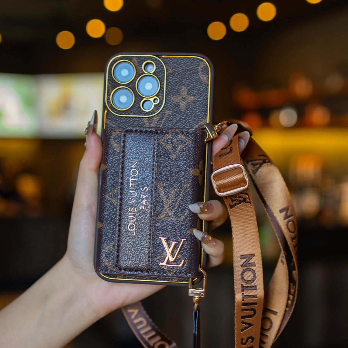 Louis Vuitton-inspired leather iPhone case with card holder and strap