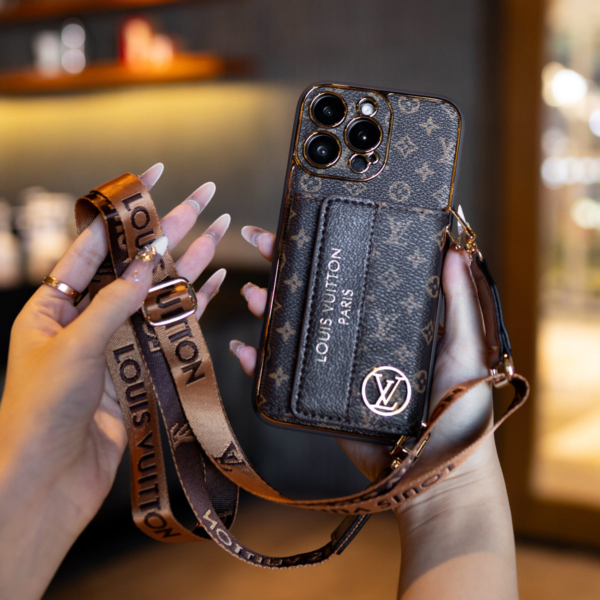 Louis Vuitton-inspired leather iPhone case with card holder and strap