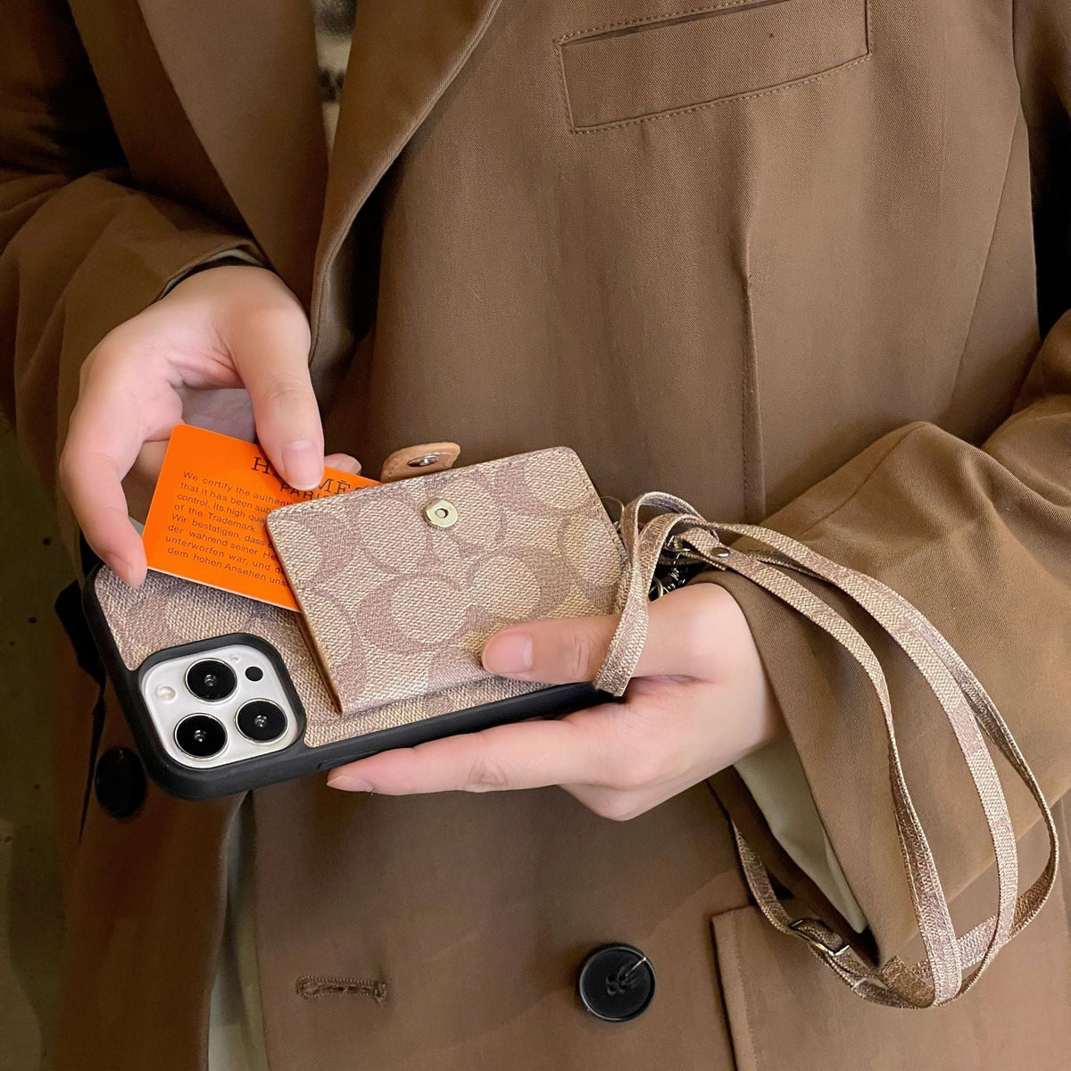 Coach-inspired leather iPhone case with card holder and strap