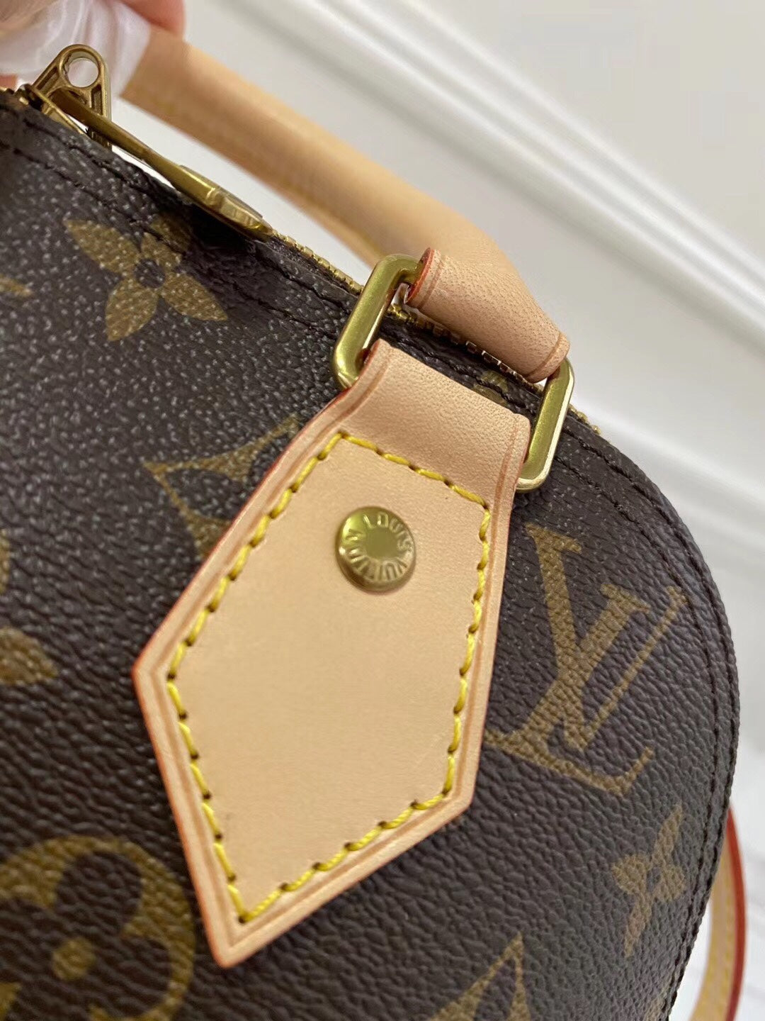 Louis Vuitton-inspired dome-shaped monogram handbag