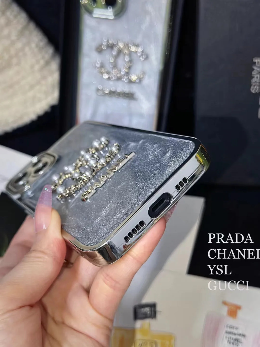 Chanel-inspired glitter case for iPhone 15 Pro Max with chain detail
