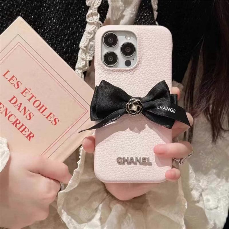 Chanel-inspired pearl strap iPhone case with bow detail