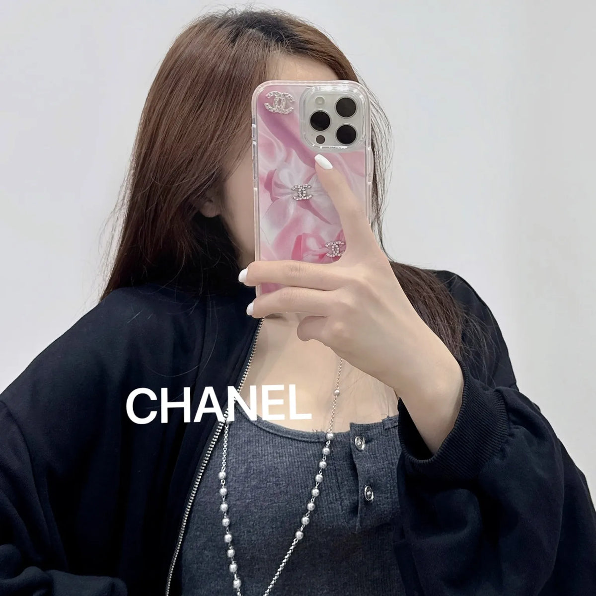 Chanel-inspired marbled case for iPhone 16 Pro Max with charm details