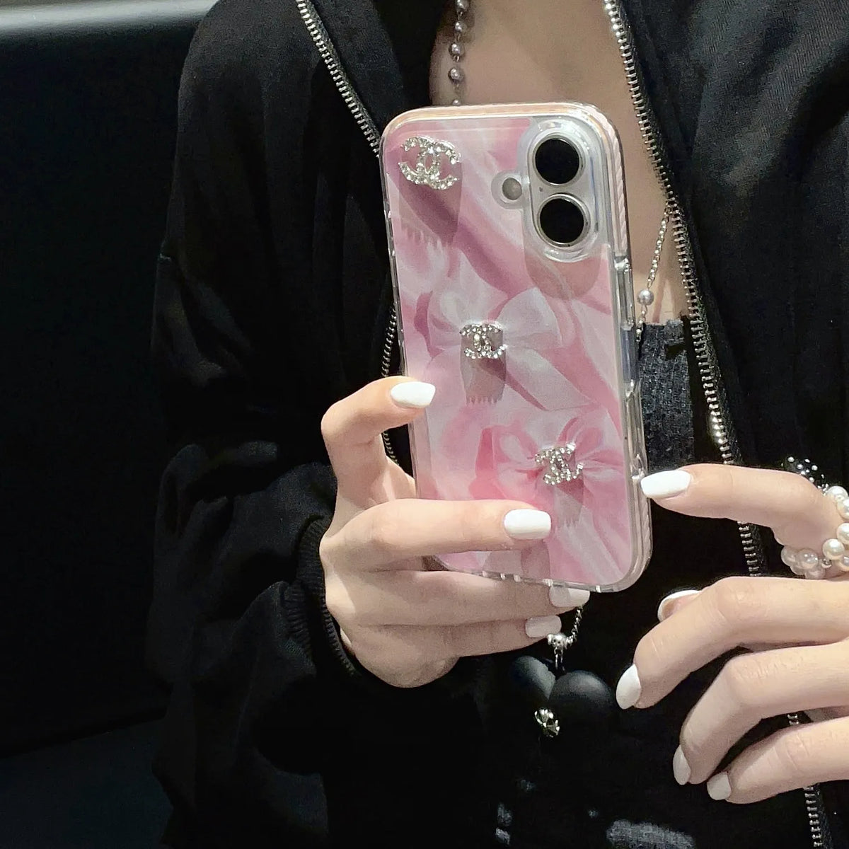Chanel-inspired marbled case for iPhone 16 Pro Max with charm details