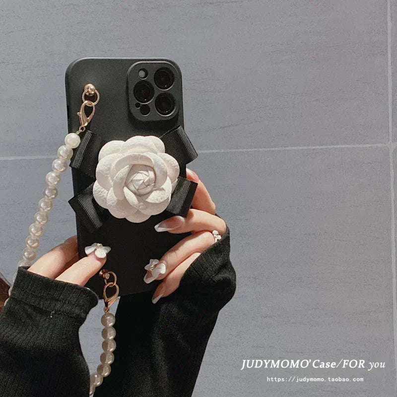 Chanel-inspired camellia flower phone case with beaded strap