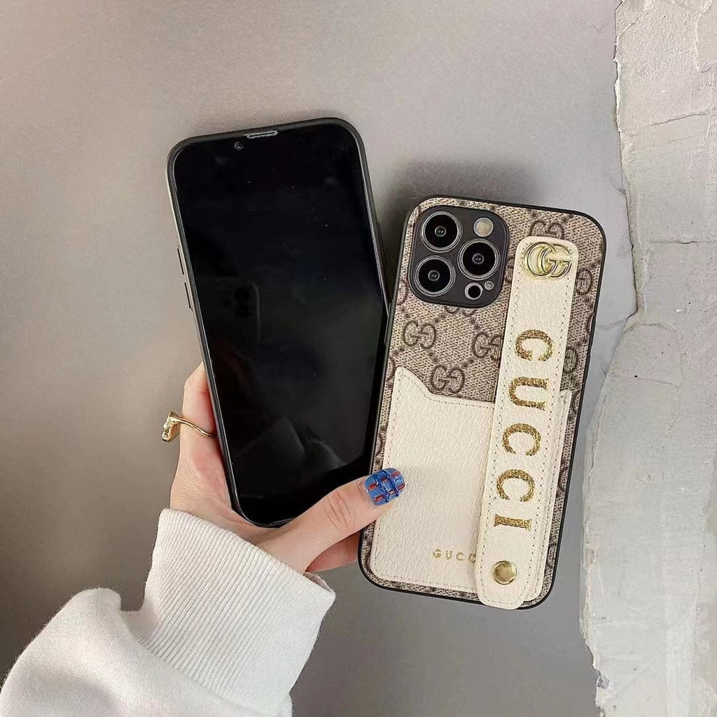 Gucci-inspired monogram phone case with studded hand strap