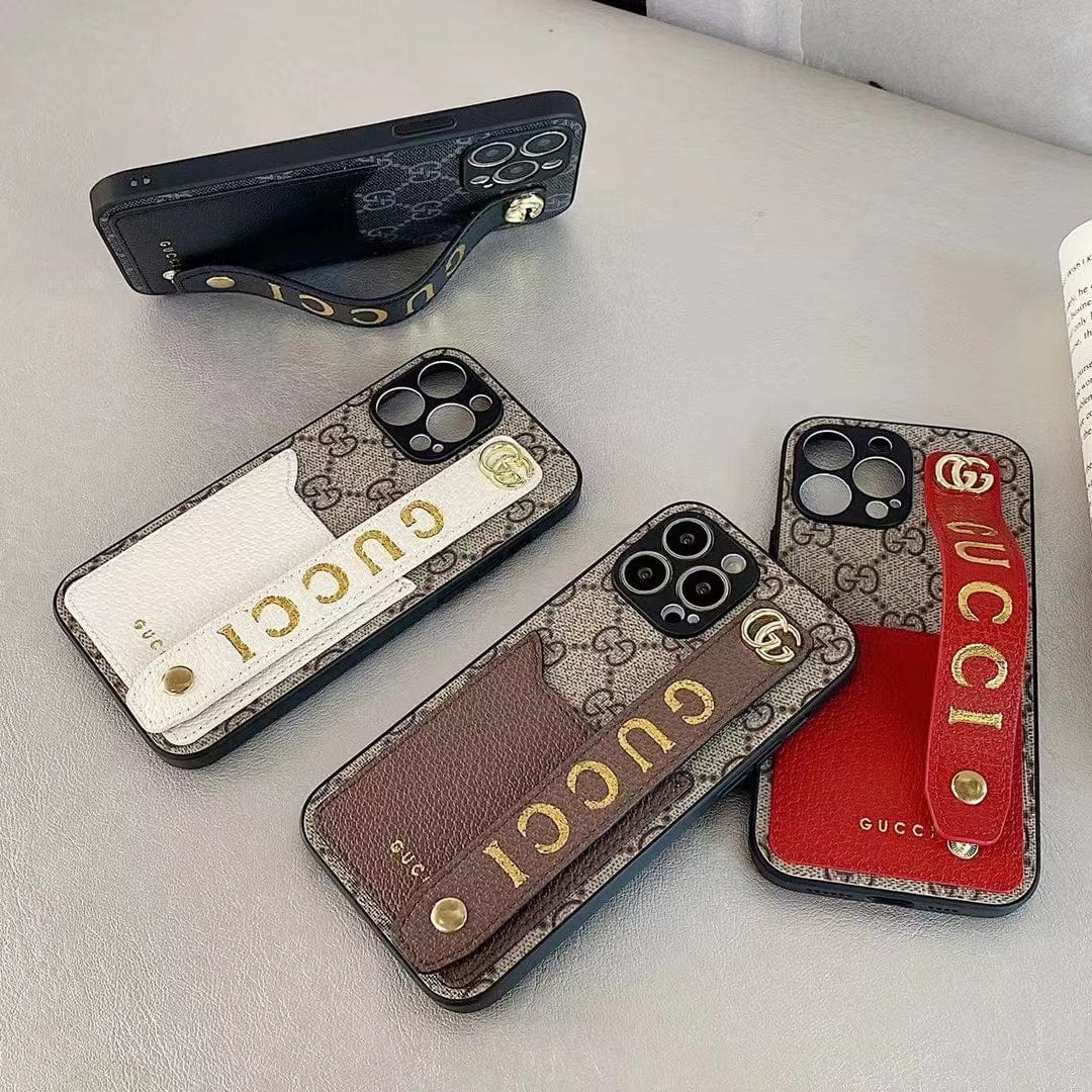 Gucci-inspired monogram phone case with studded hand strap