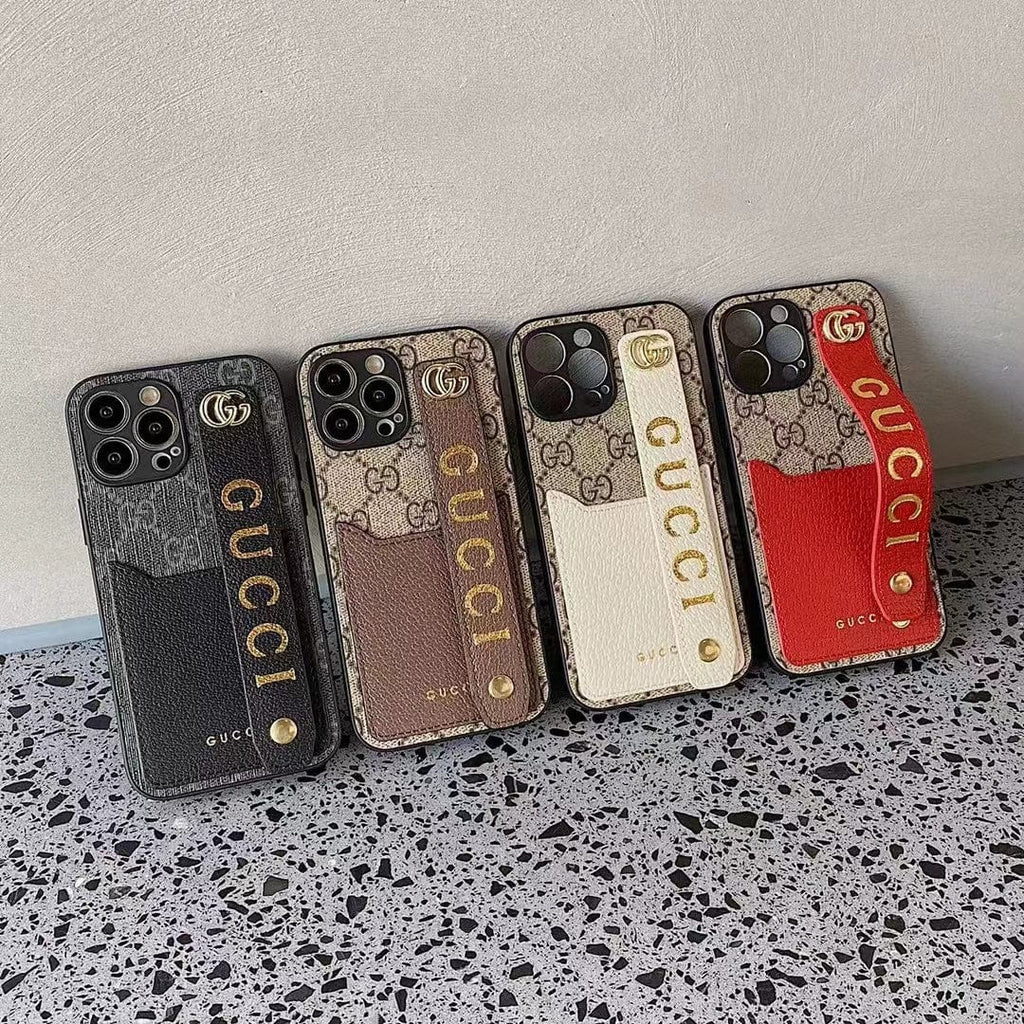 Gucci-inspired monogram phone case with studded hand strap