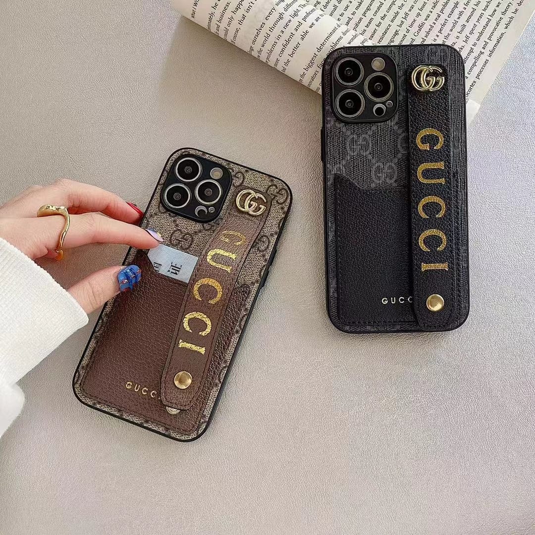 Gucci-inspired monogram phone case with studded hand strap