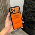 Prada-inspired puffer iPhone case with triangle detail