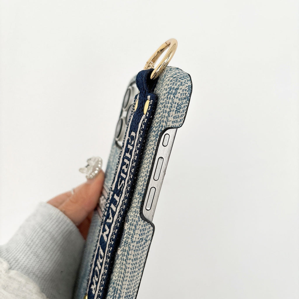 Dior-inspired patterned phone case with wide hand strap