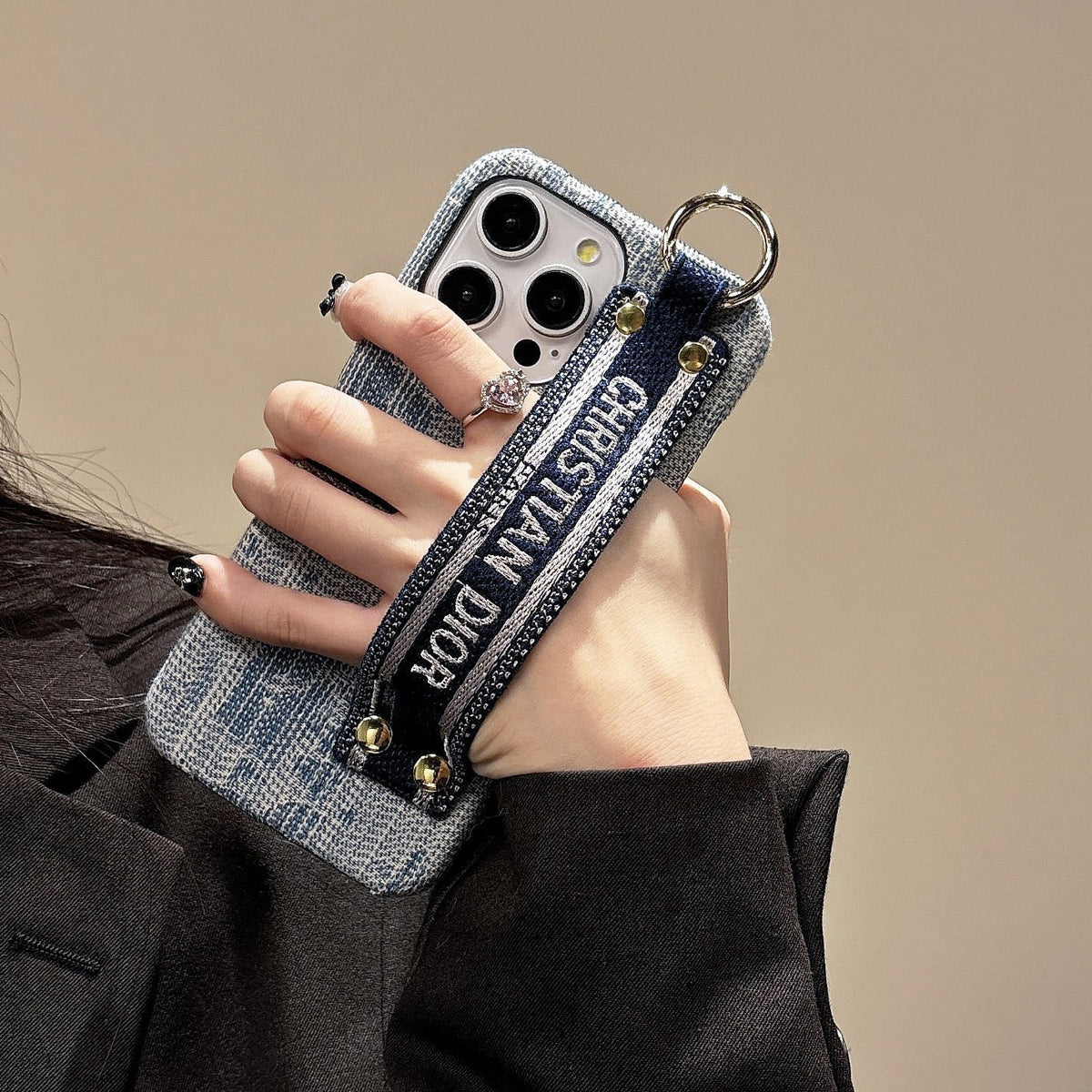 Dior-inspired patterned phone case with wide hand strap