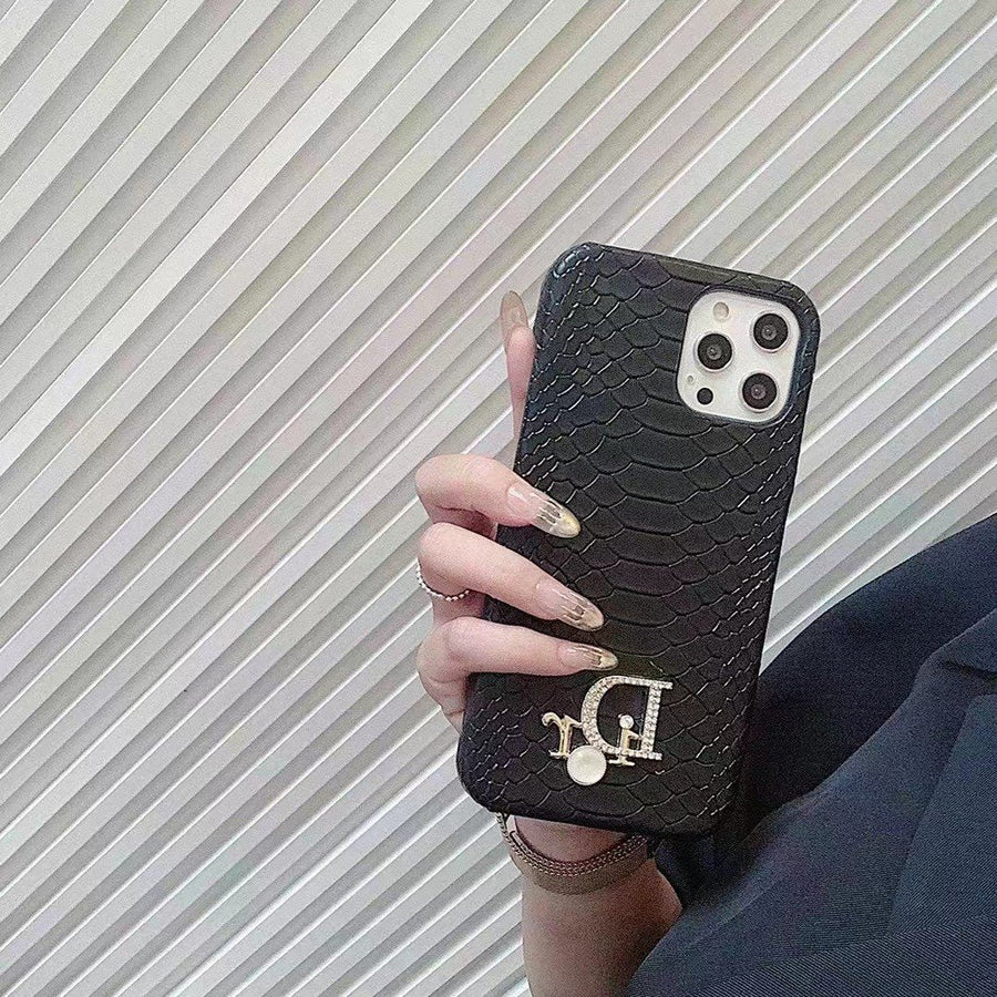 Dior-inspired snake texture iPhone case with emblem detail