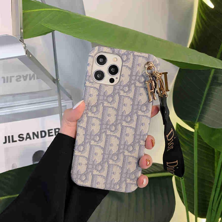 Dior-inspired all-over pattern phone case with hand strap