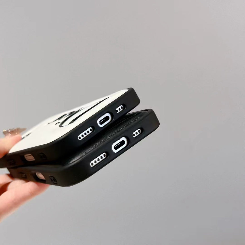 Dior-inspired black and white iPhone 16 Pro case with raised lettering