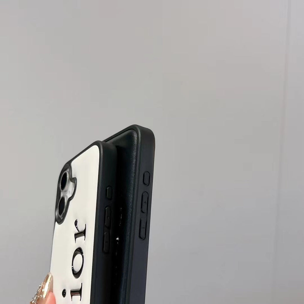Dior-inspired black and white iPhone 16 Pro case with raised lettering