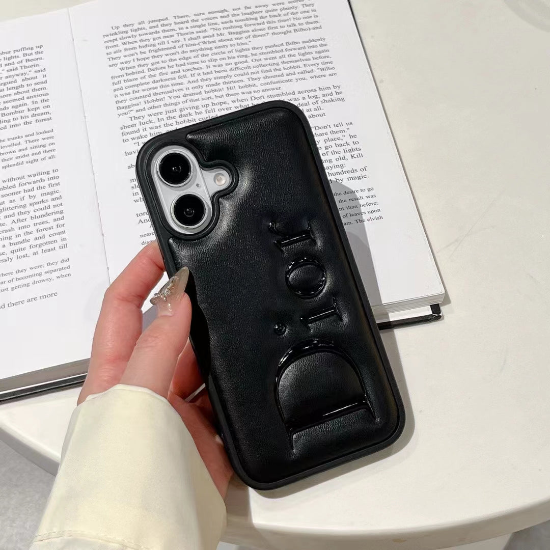 Dior-inspired black and white iPhone 16 Pro case with raised lettering
