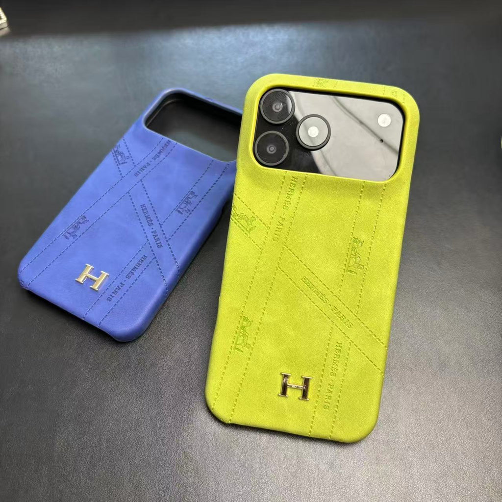 Hermes-inspired solid color iPhone 17 case with metal initial detail