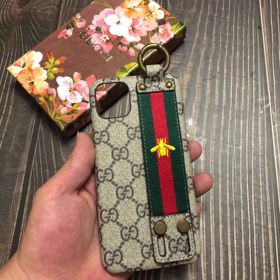Gucci-inspired monogram iPhone case with striped hand strap