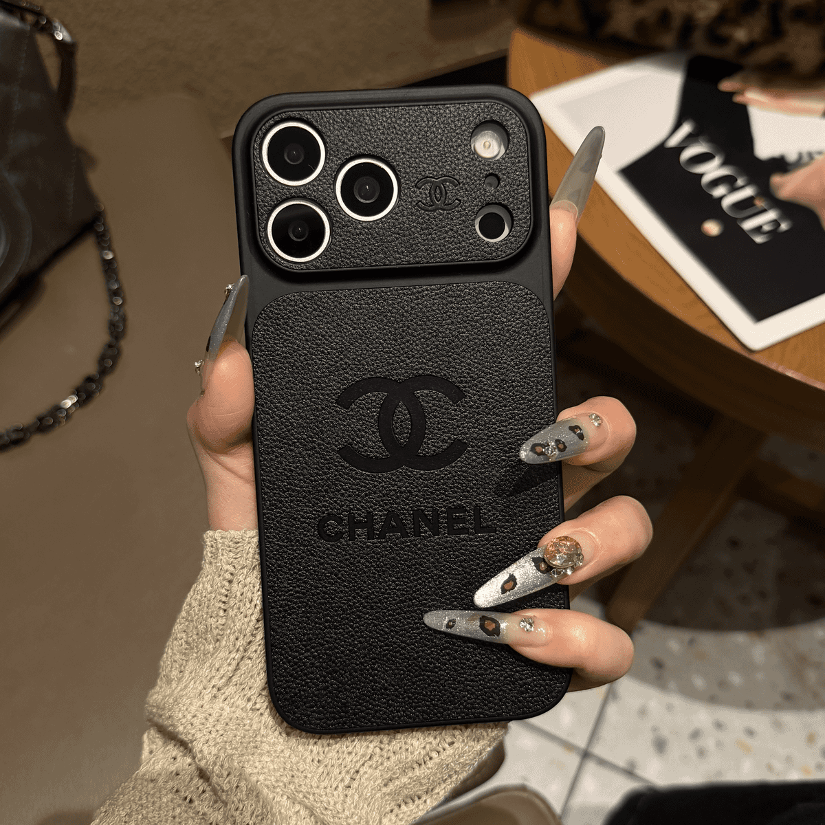 Chanel-inspired solid color iPhone case with embossed emblem
