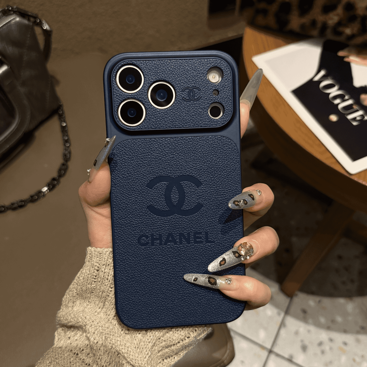 Chanel-inspired solid color iPhone case with embossed emblem