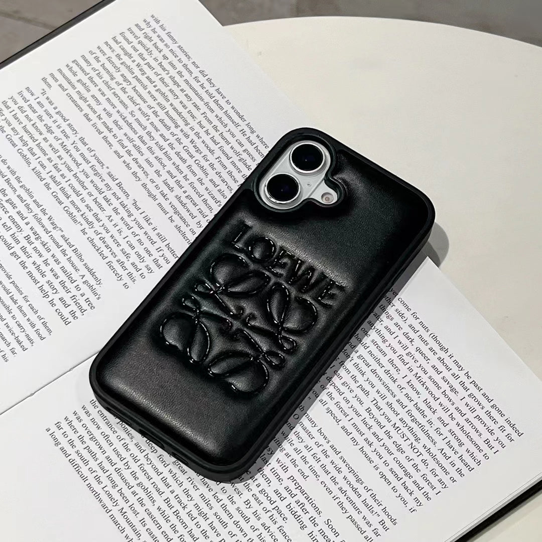 Loewe-inspired black and white iPhone 16 Pro case with emblem