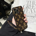 Louis Vuitton-inspired monogram iPhone 16 Pro case with matching strap, brown