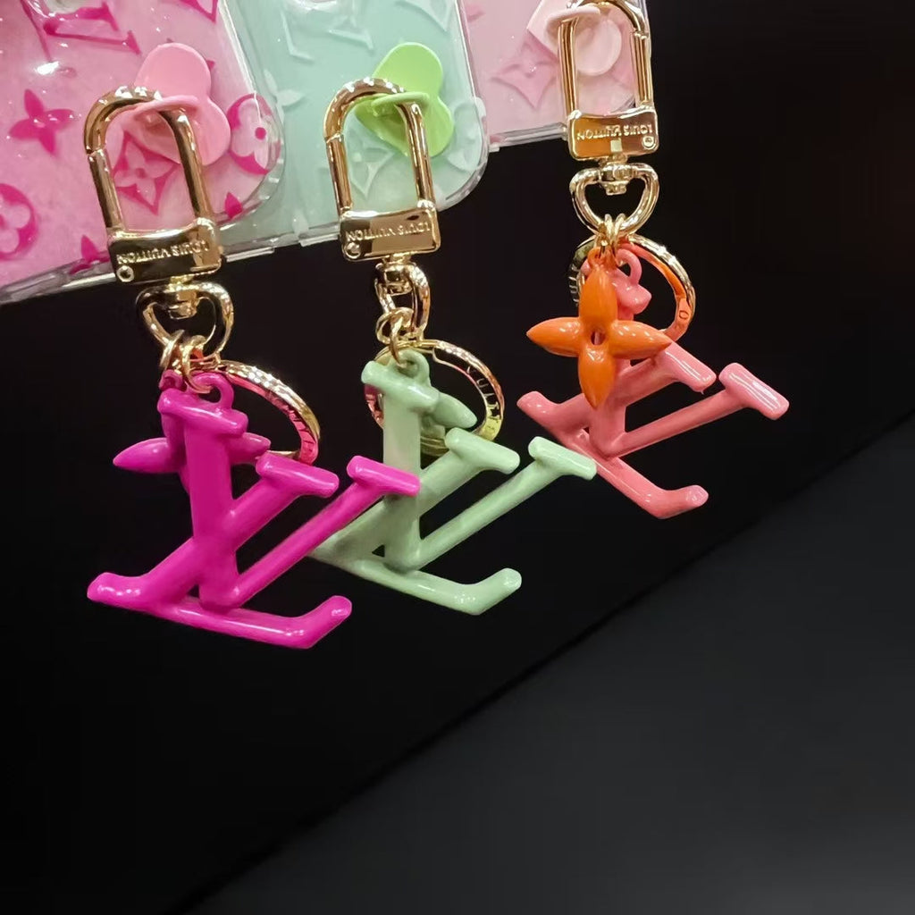 Louis Vuitton-inspired monogram iPhone 16 Pro Max case with hanging charm