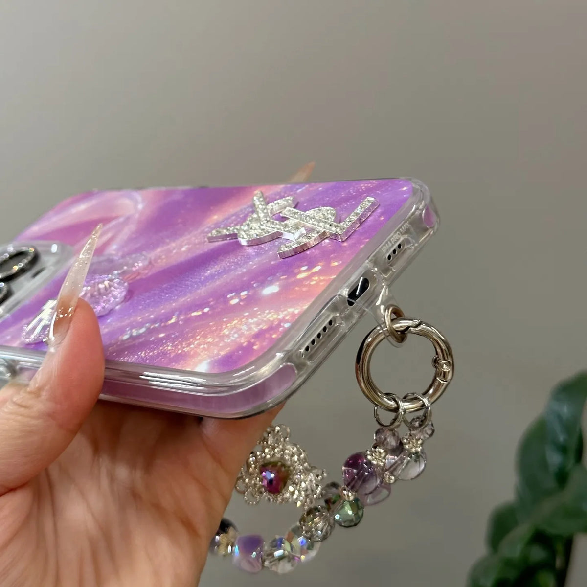 Louis Vuitton-inspired marbled phone case with chain charm